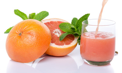 Grapefruit juice poured into a glass