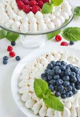 Meringue cakes with blueberries and raspberries