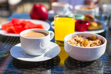 Delicious breakfast with flakes,dried fruit and cup of cacao