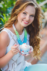 Portrait of a young happy woman in summer