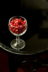 pomegranate seeds on black