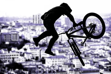 Fotobehang Silhouette bmx sport rider in action with scenery background © avarand