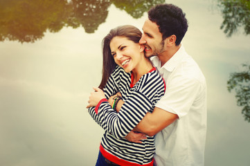 happy romantic wide smile couple in love at the lake outdoor on