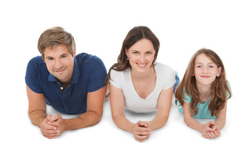 Fototapeta na wymiar Family Lying Over White Background