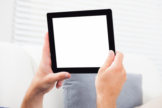 Man Holding Digital Tablet With Blank Screen