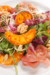 Hot salad with vegetables and nuts