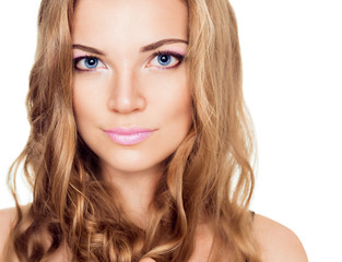 Fototapeta premium A beautiful young woman with a pink make up and long curly hairs
