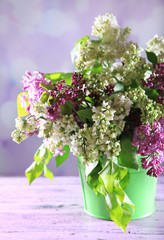 Beautiful lilac flowers in vase,