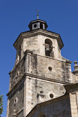Fototapeta na wymiar Bell tower in Collegiate Church of Santa Maria