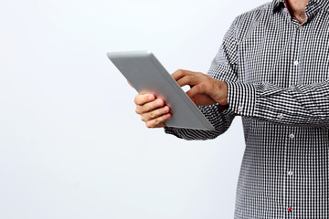 Closeup image of a man using tablet computer