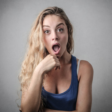 young woman looking surprised