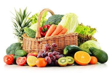 Wicker basket with groceries isolated on white © monticellllo
