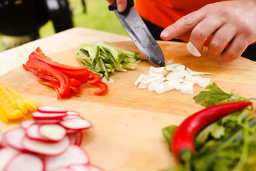 man cutting vegetables