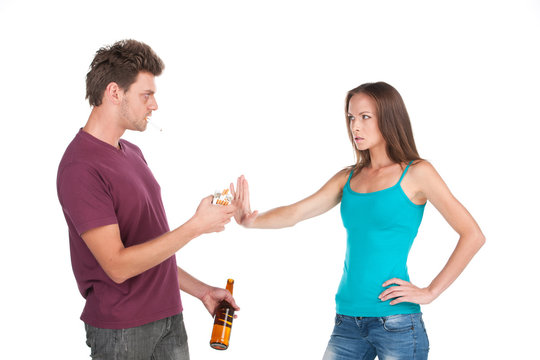 Drunk man gives cigarette to girl
