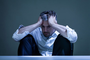 Depressed man at work