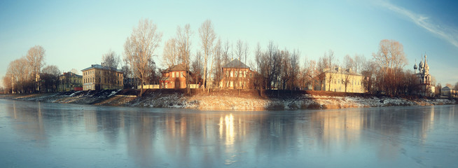 frozen river shore small town
