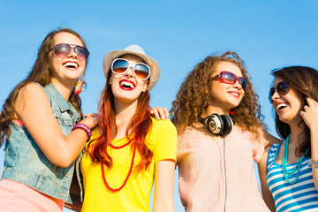 group of young people wearing sunglasses and hat