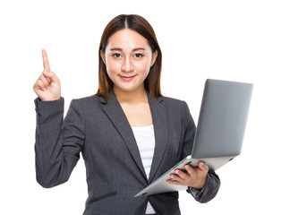 Asian mixed businesswoman with laptop computer and finger up