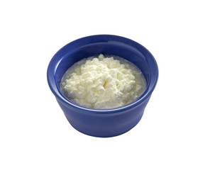 cottage cheese in ceramic cup on white background