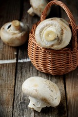 Whole button mushrooms in a basket