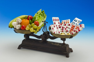 Healthy food versus medical pills.
