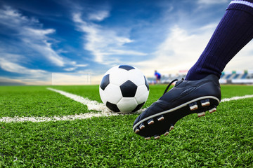 foot kicking soccer ball
