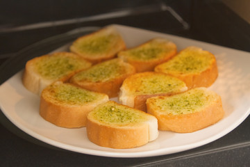 Fresh homemade garlic bread in microwave oven