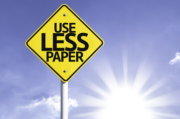 Use Less Paper road sign with sun background