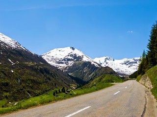 Road with a view over snowy mountain.