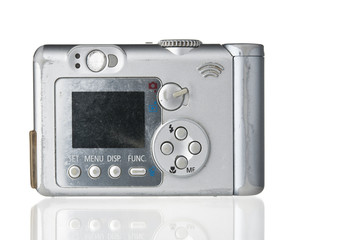 Grunge compact photo camera on white backdrop