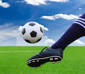 foot kicking soccer ball