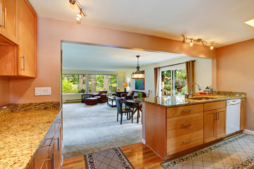 House interior with open floor plan. Kitchen area