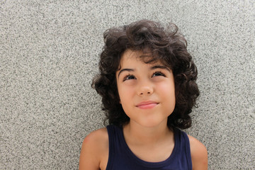 Portrait of an attractive child with curly hair