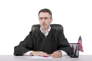 middle aged caucasian american judge in a robe sitting