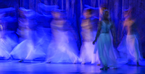 Group of contemporary dancers performing on stage