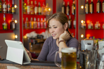 Bartender girl behind the counter