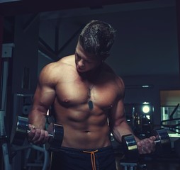 Guy doing exercises with dumbbells