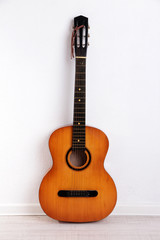 Guitar on the floor on white background