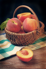 fresh peaches in a wicker basket
