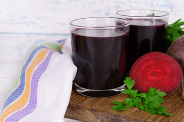 Glasses of fresh beet juice and vegetables