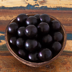 Brazilian berry Jaboticaba in bowl on wooden table
