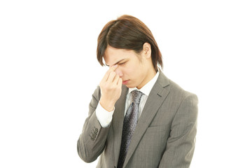 頭痛を訴えるビジネスマン
