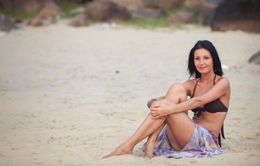 brunette girl in flower skirt and brown bra