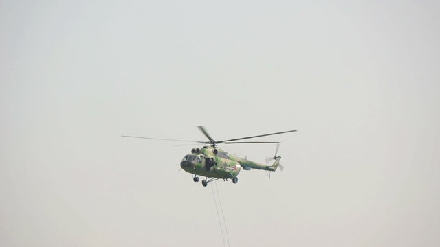 Military helicopter flying by