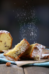 Tasty cake on table on dark background