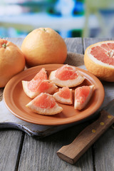 Ripe grapefruits and knife