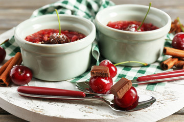 Tasty cherry dessert on table