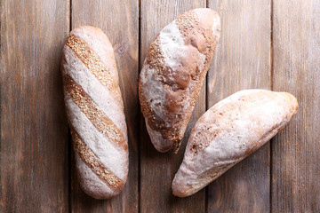 Fresh bread on wooden background