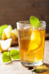 glass of ice tea with lemon and melissa