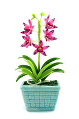 Purple fake flowers in the vase